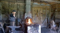 Stoking the fire in the forge
